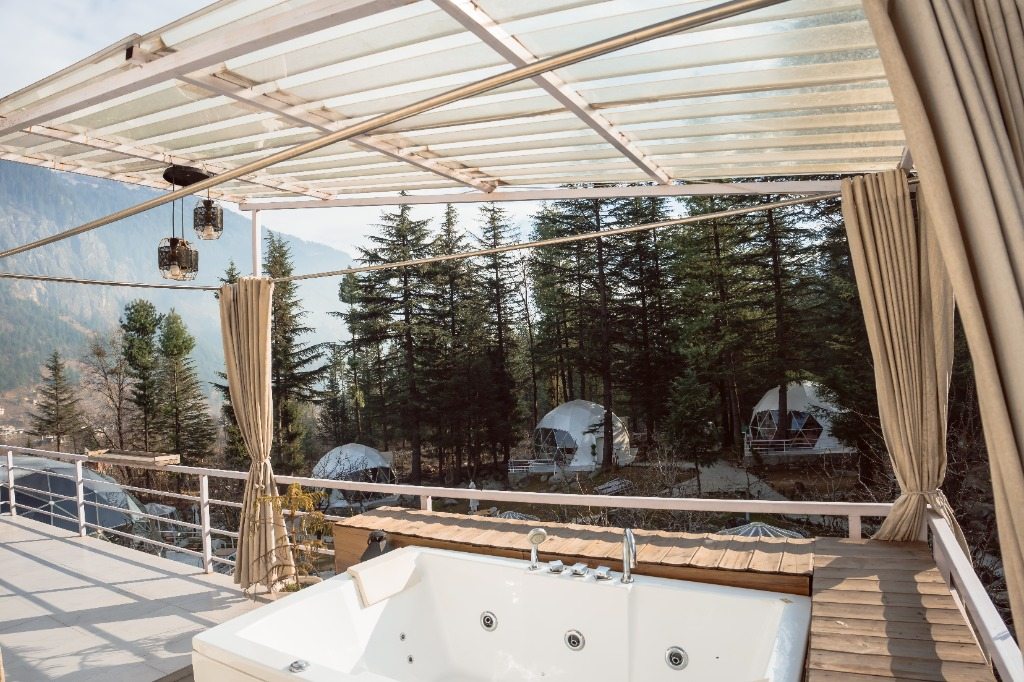 Outdoor scenic deck with jacuzzi overlooking mountains