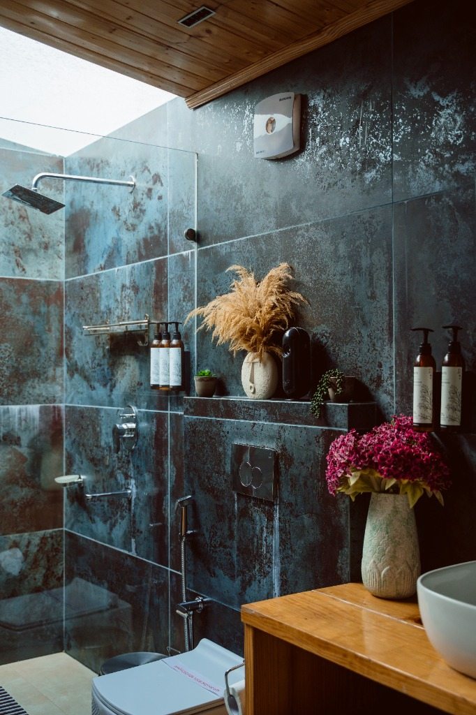 Rustic slate luxury washroom with overhead rain shower